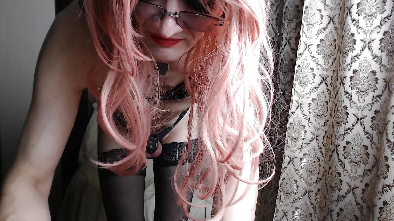 A Transvestite, a Slutty Girl in a Maid's Dress, Records Herself on Webcam