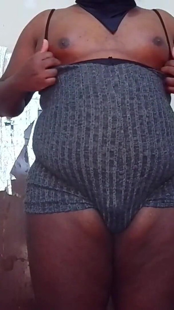 Captivating moment from "Sissy Showing Her Chubby Body."