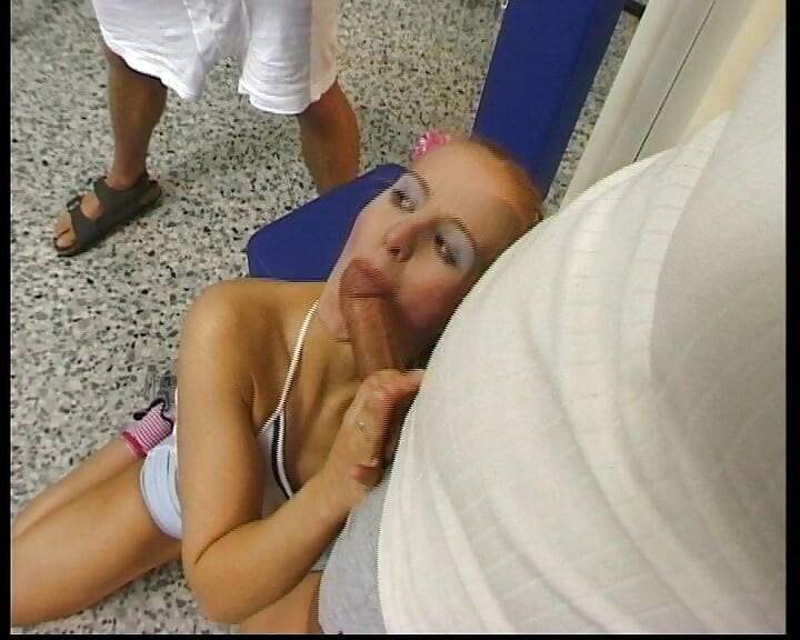 Petite blonde German babe rides two dicks in the gym