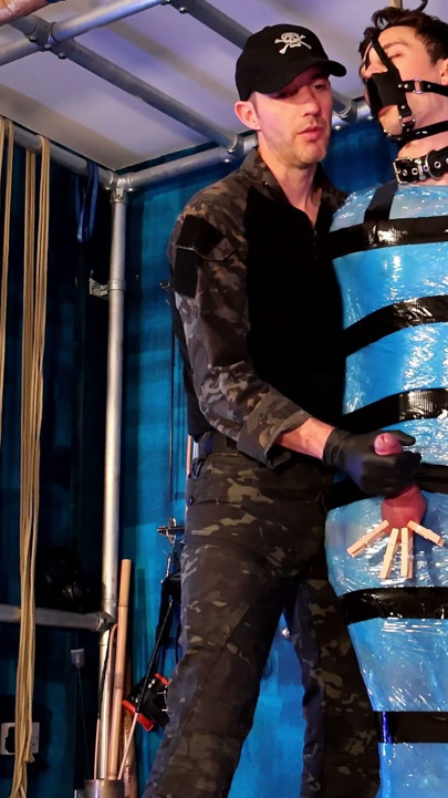 Twink Slave Bound in Pallet Wrap for Orgasm Control
