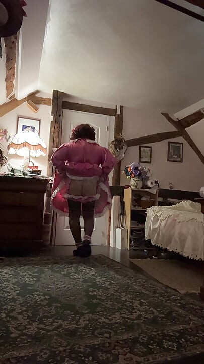 Dressed in a pink maid outfit for the day