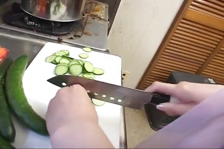 Insatiable Young Wife Drenches Cucumber Deep in Kitchen Sink
