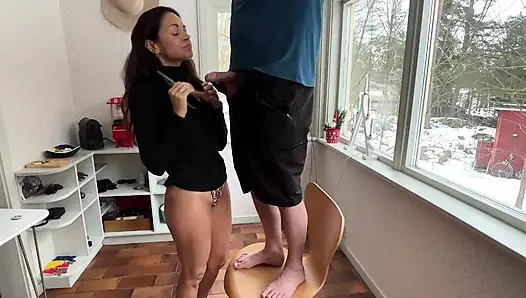 Wife interrupts husband as he does some electricity work in the kitchen