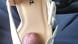 customer white wedge shoes in luggage bag
