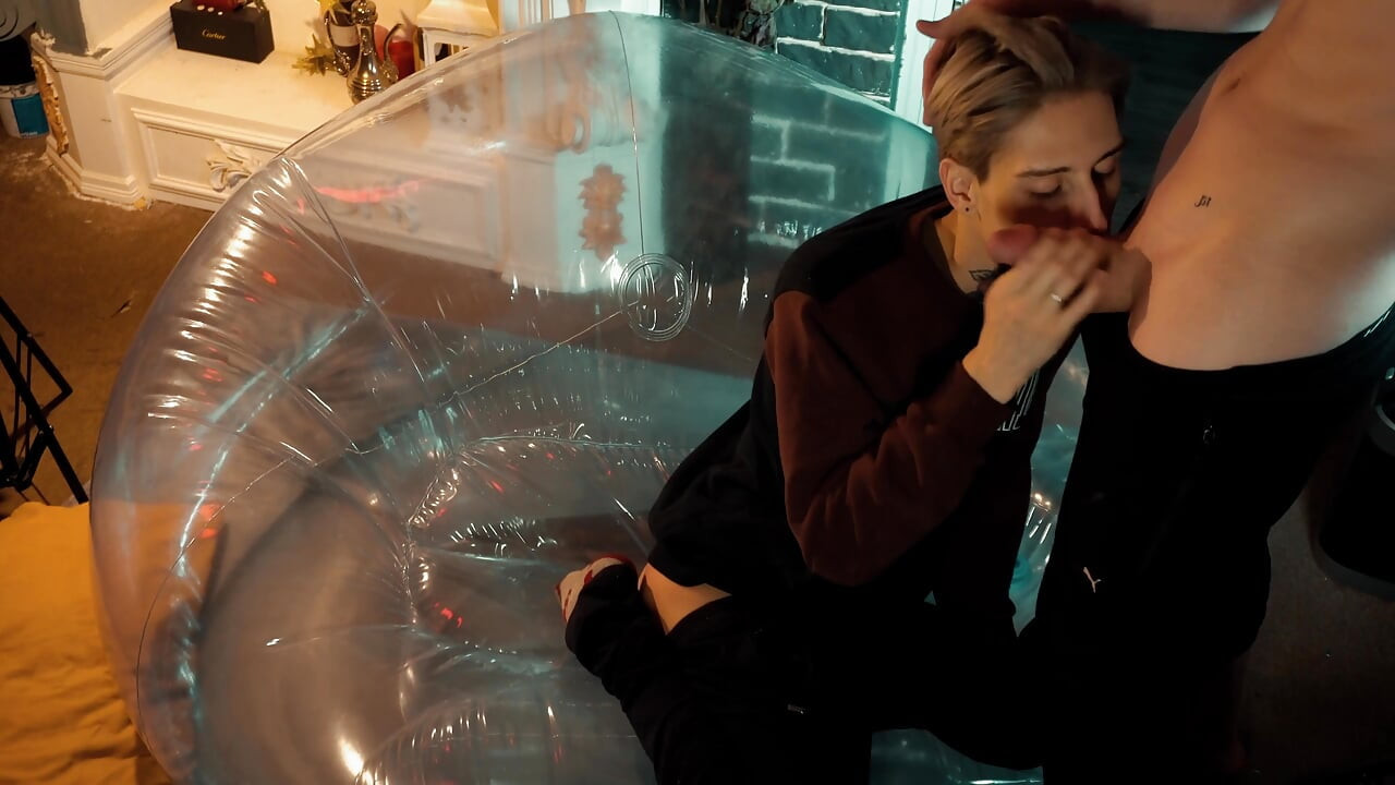 Two sweet guys share an inflatable chair