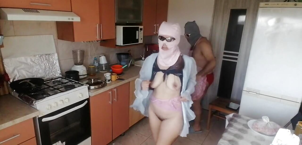 Couple Having Fun in the Kitchen. Sexy Wife Doing Chores in the House Naked