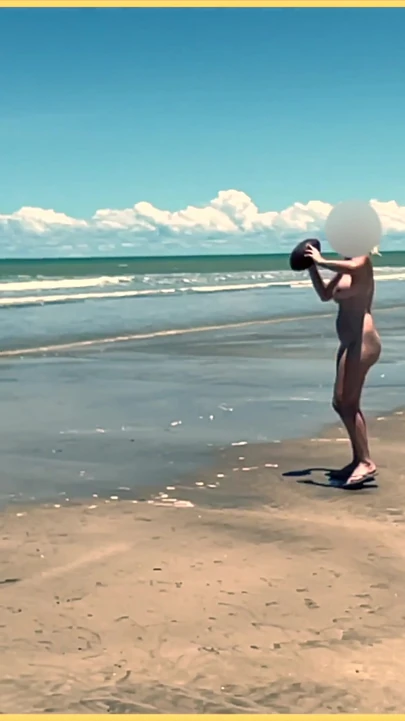 Jaw-dropping moment from "Wifey strips nude and plays with the football at the beach"