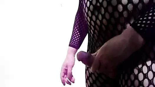 Man in fishnet bodystocking wanking
