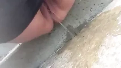 Close-up BBW with large bald pussy public street peeing 1