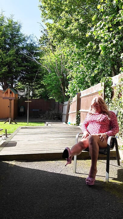Crossdressing kellycd2022 in pink outfit and heels