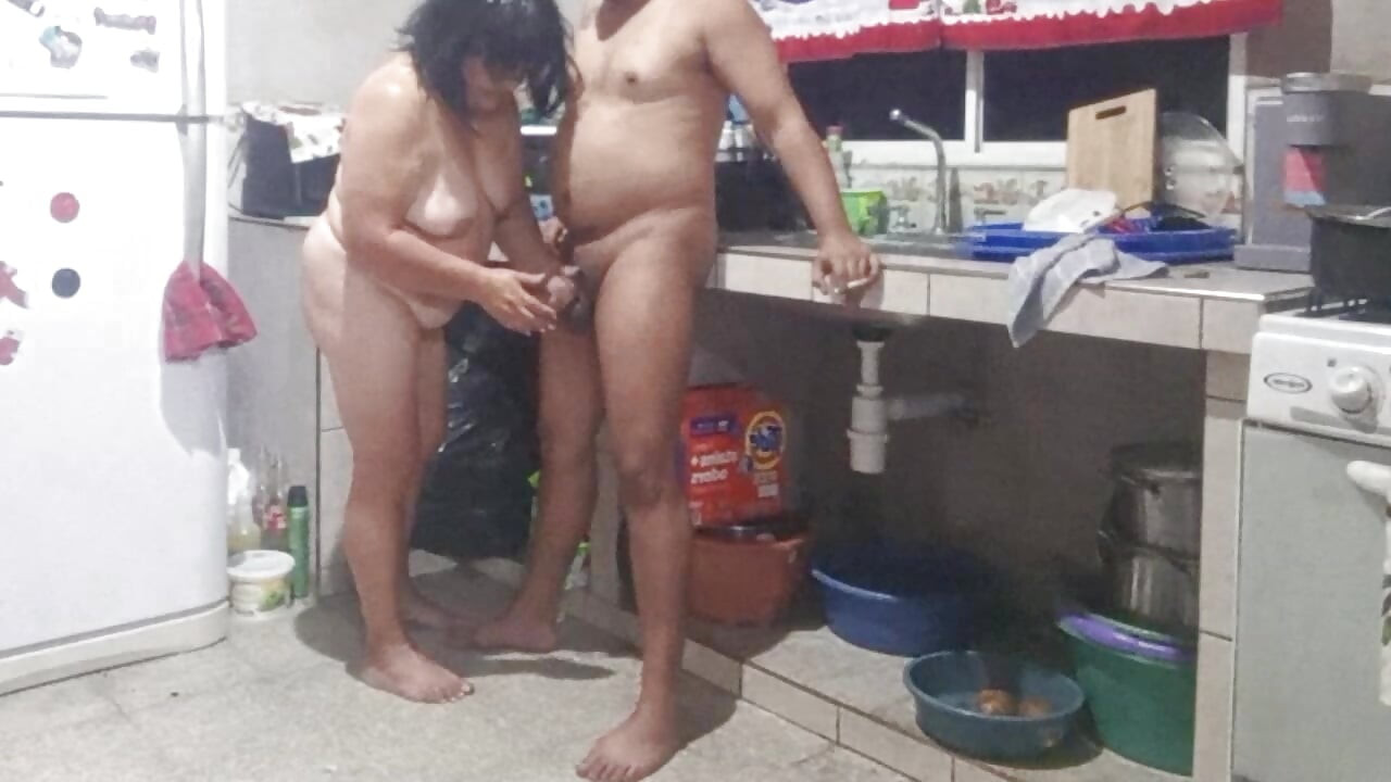 My mother-in-law masturbates me in the kitchen and wants me to fuck her doggy style.