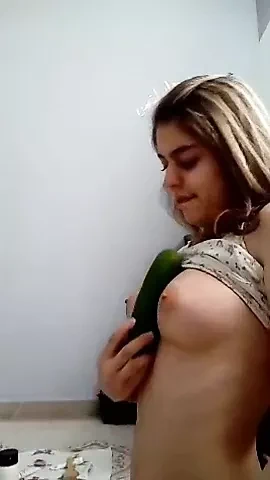 Iranian girl has fun with a cucumber