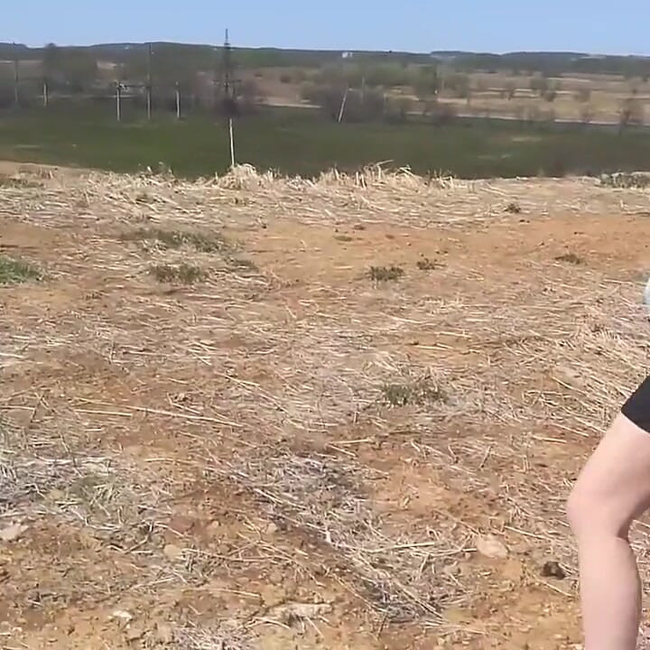 Girl undresses on a windy day