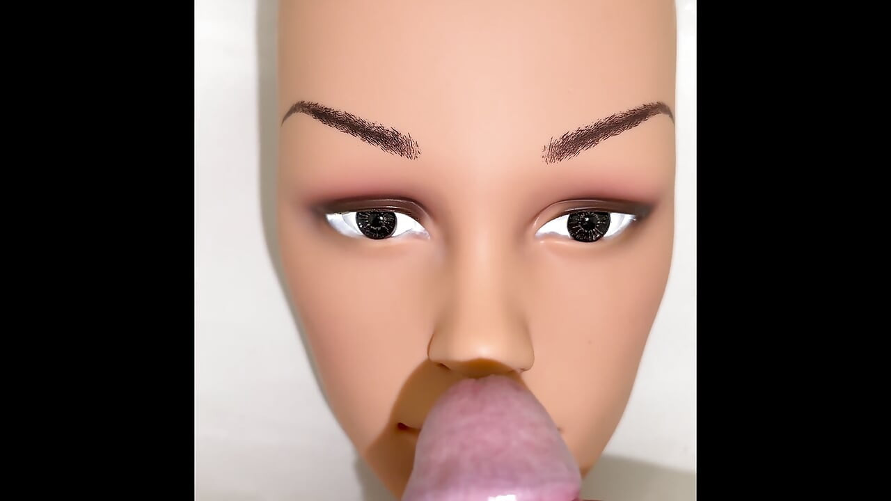 Pissing on a mannequin doll's face