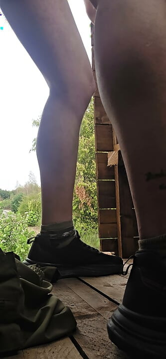 Riding a big dildo on a high seat in the forest