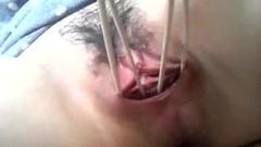 Una studentessa cinese arrapata, la figa di Nals con un dildo improvvisato