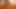 Selena's naked posing in a warm light
