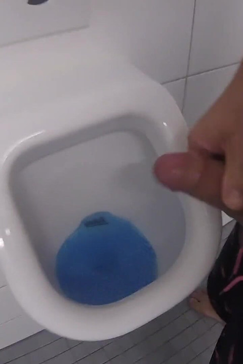 Outdoor Pool Restroom: Pissing and Jerking off My Thick, Shaved Cock at the Urinal, and Then Shooting My Load Into It.
