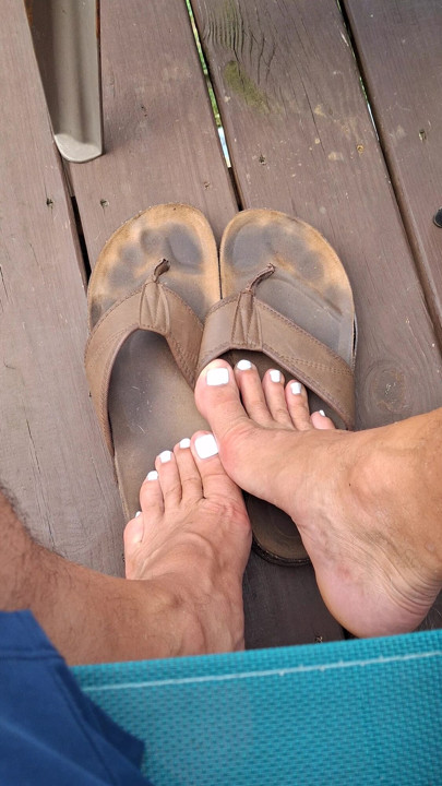 Showing off my dirty worn leather sandals and my cute painted toes