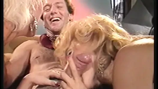 2 porn sluts tease each other's naked bodies while on porn set
