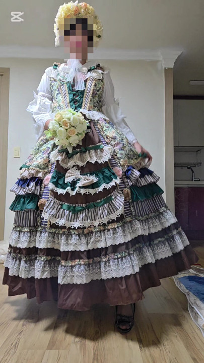 A crossdressing man is wearing a dress and dancing.