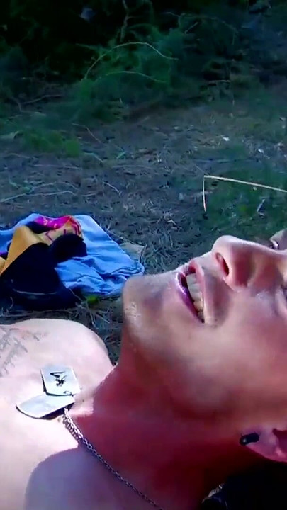 Key moment from "Redhead voyeur in wood joins photoshooting with pierced dick"