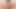 Dark-haired ladyboy in tight dress pumps her shaved cock on