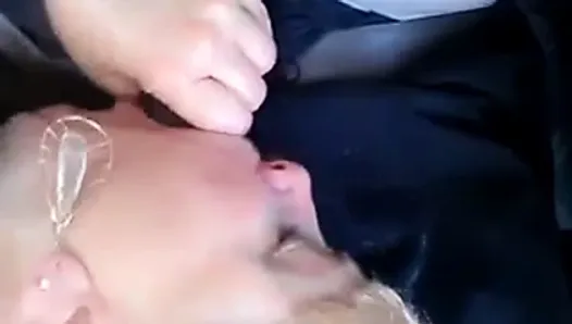 Mature blonde woman sucking black cock on car