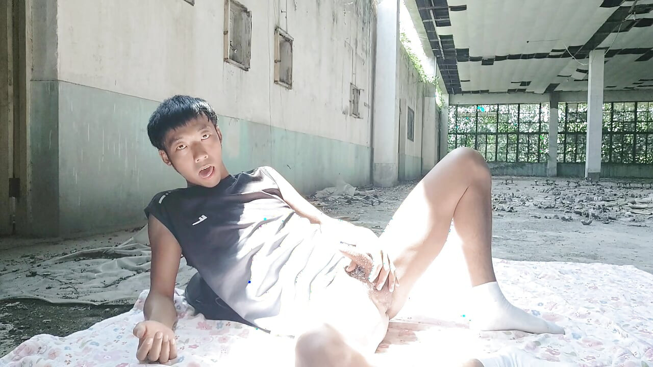 Cute Asian boy masturbates, moaning, ejaculating, and consuming fluids in a dreamlike light and shadow environment