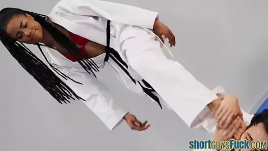 Ebony rides short guy’s cock during karate class