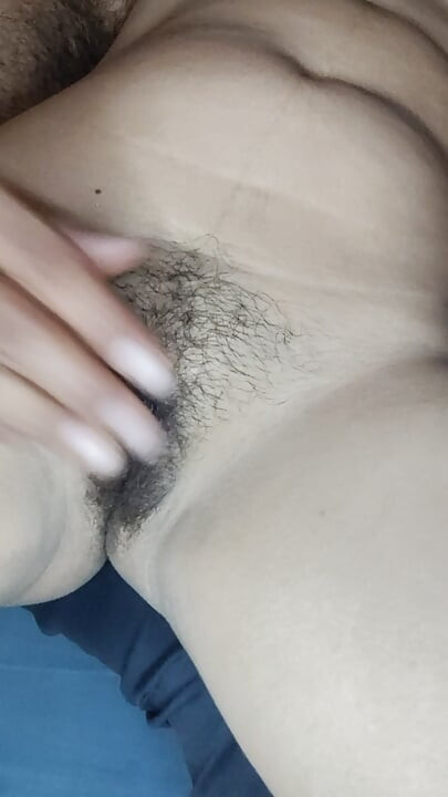 Fingers inserted into pink tight