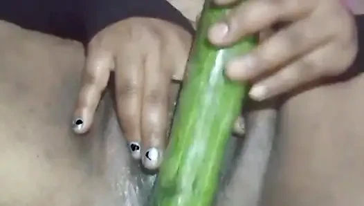 Today, Indian bhabhi quenched her desire by inserting a cucumber into her pussy.