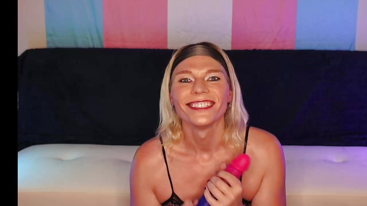 Sexy hot trans MILF sucks and play with huge dildo while humiliating fans small cocks.