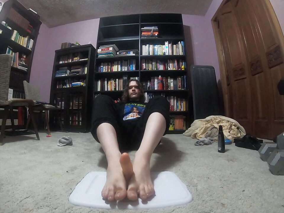 Chubby boy gives his dildo a footjob