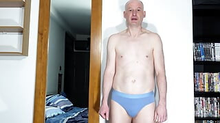 Zoom in close up as man takes off underwear and wanks his uncut cock from soft to throbbing erection