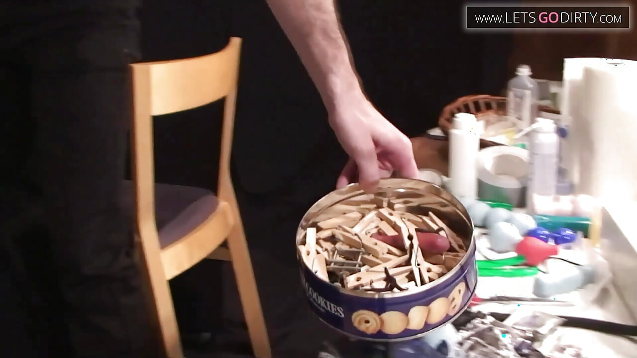 Hot girl gets dildo fucked while pussy is clipped with pegs