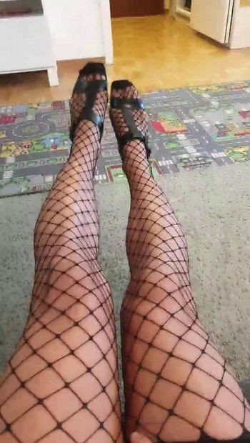 Crossdress showing her long legs and big cock in fishnet