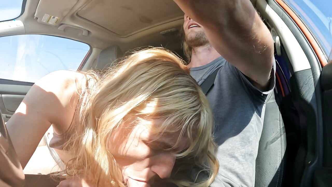 Petite Blonde Gives Her Man Road Head In The Car