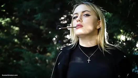 Hot Blonde Babe Smoking Two Black Cigarettes in Nature