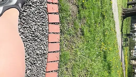 Sexy hot stepmom is horny and caresses herself on a park bench