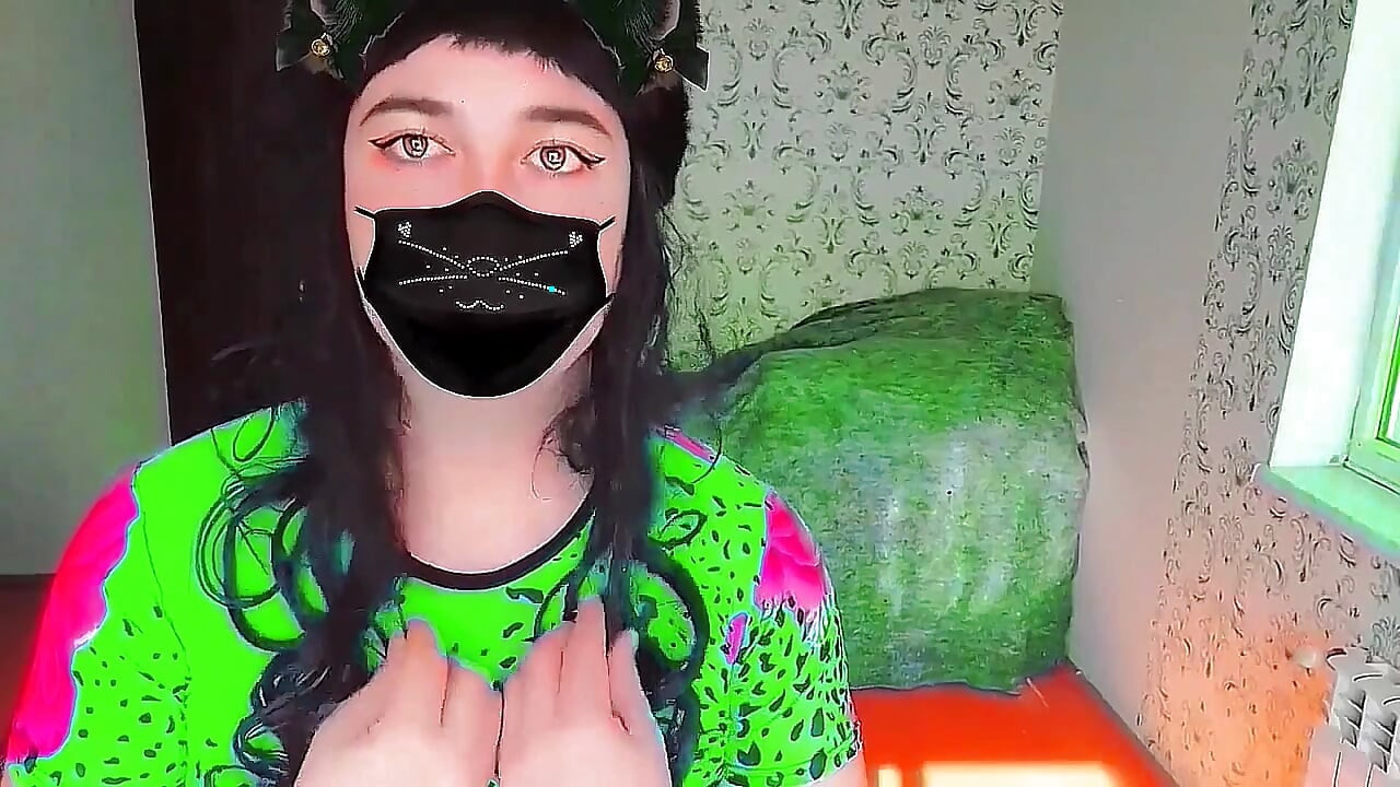 Cute sissy wearing fluffy earmuffs in cozy sweater
