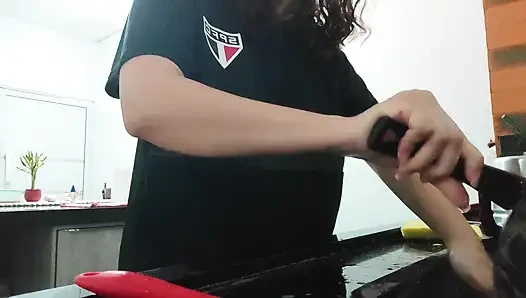 Woman teasing while washing dishes. She loves to transmit to the voyeurs on duty