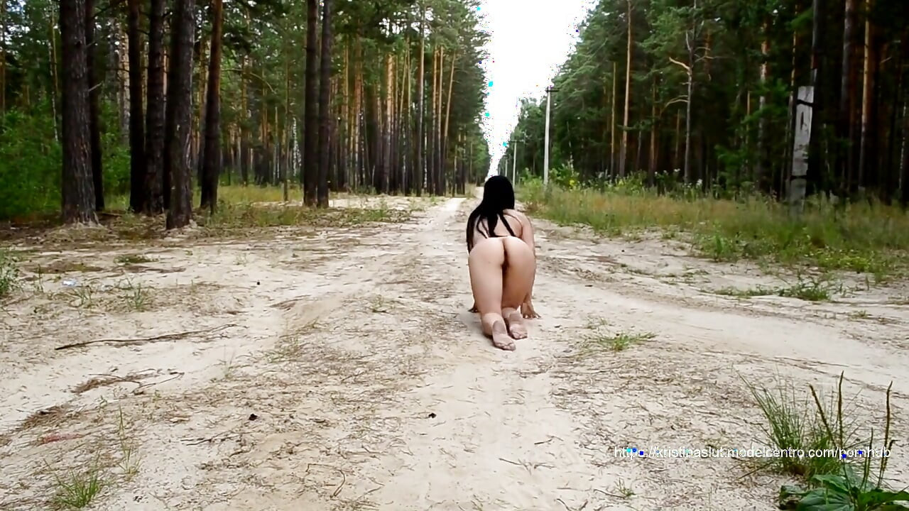 The Cat Walks Along the Street Completely Naked and Pissing