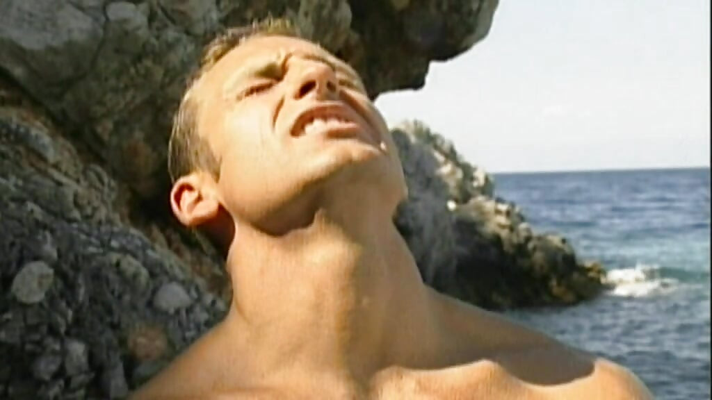 Two Hung Muscle Studs Pound a Young Jock Anal on the Sand in