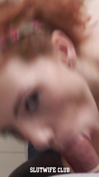 Karla Rose kneels before me, her natural big tits bouncing as she worships my cock.