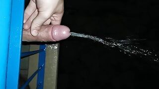 Peeing from the balcony while it rains. Dick german dick pissing outdoor.