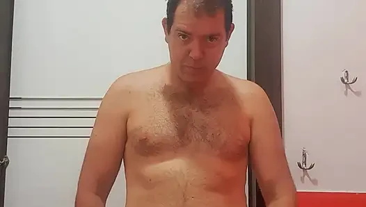 A boy completely naked in a station bathroom
