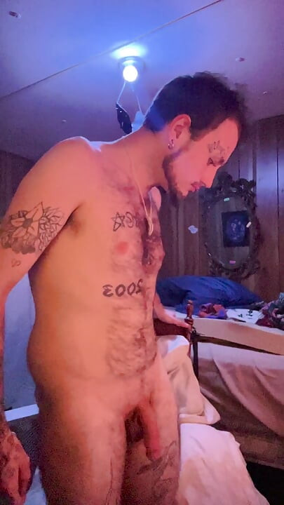 Tattoo stud playing with his cock