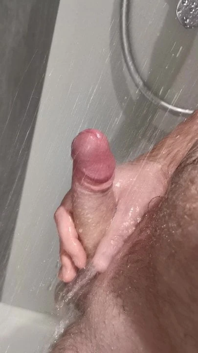 Wanking big white uncut cock in shower.
