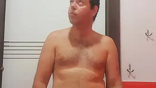 A boy completely naked in a station bathroom
